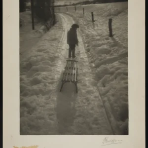 Photograph by Olaf Christoffersen of a boy standing with his sled in the late winter snow, capturing the quiet transition of seasons and a contemplative moment.