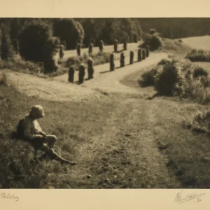 Photograph by Olaf Christoffersen from 1930 of a boy whittling in the Asker countryside, blending the soft tones of pictorialism with the clarity of modernism.