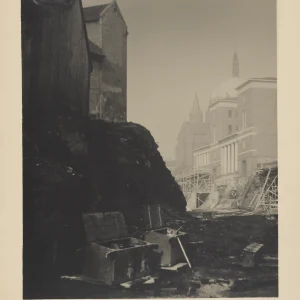 Historical photograph of Oslo's urban development in 1934 by Olaf Christoffersen, showing the newly built Deichman Library alongside older wooden houses and Trinity Church in the background, symbolizing the city's modernization.